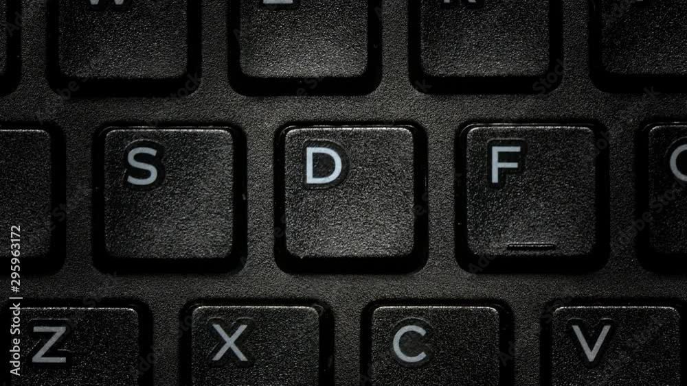Computer PC Keyboard Letters close up macro. Camera handheld and fast transition Alphabet Computer PC Keyboard Letters close up macro. Camera handheld and fast transition Alphabet