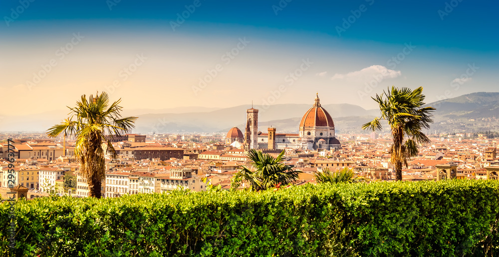 Florence, Italy: scenic view on famous italian town with Duomo and palm trees at sunset