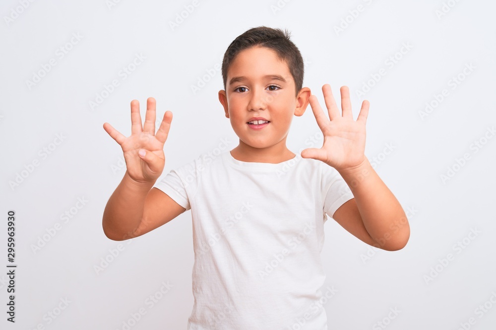 Beautiful kid boy wearing casual t-shirt standing over isolated white background showing and pointing up with fingers number nine while smiling confident and happy. Beautiful kid boy wearing casual t-shirt standing over isolated white background showing and pointing up with fingers number nine while smiling confident and happy.