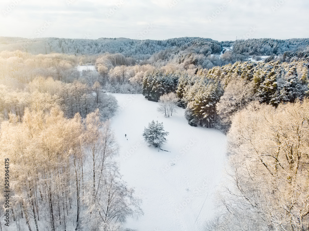Beautiful aerial view of snow covered pine forests. Rime ice and hoar frost covering trees. Scenic winter landscape in Vilnius, Lithuania. Beautiful aerial view of snow covered pine forests. Rime ice and hoar frost covering trees. Scenic winter landscape in Vilnius, Lithuania.