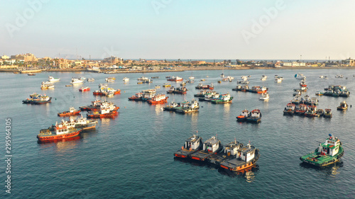 Beautiful sunset at sea, there are fishing boats in the water. fishermen near Natural Area Marina peru callao. photo