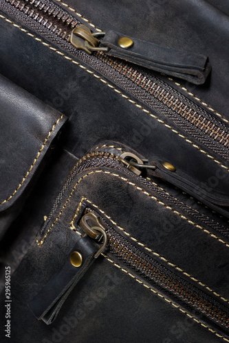 Leather bag in vintage style with zipper, pocket and stitches, casual man accessories, macro shot, selective focus 