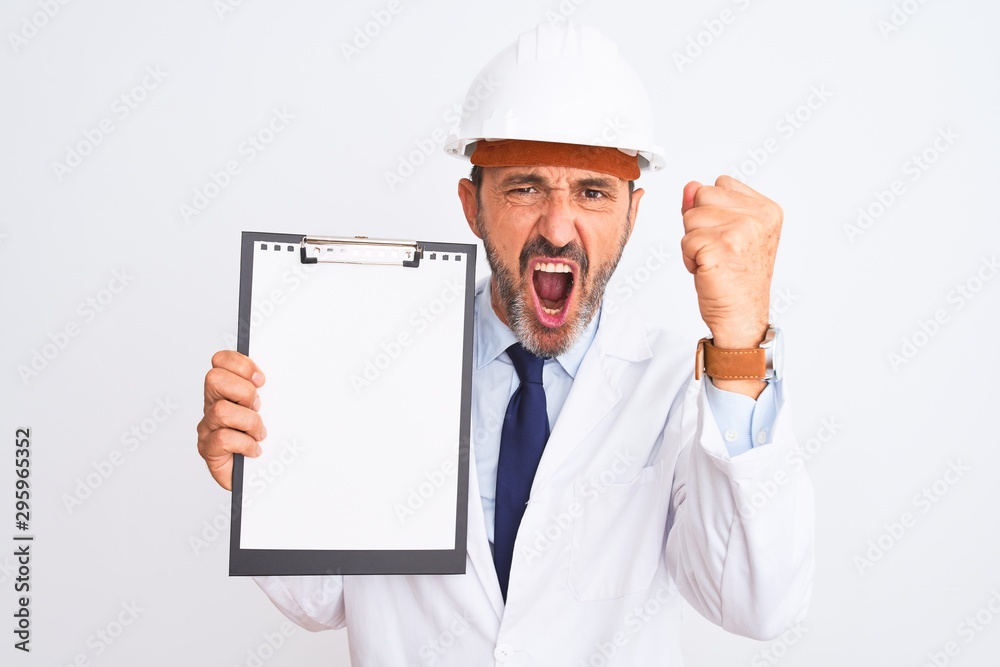 Senior engineer man wearing security helmet holding clipboard over isolated white background annoyed and frustrated shouting with anger, crazy and yelling with raised hand, anger concept Senior engineer man wearing security helmet holding clipboard over isolated white background annoyed and frustrated shouting with anger, crazy and yelling with raised hand, anger concept