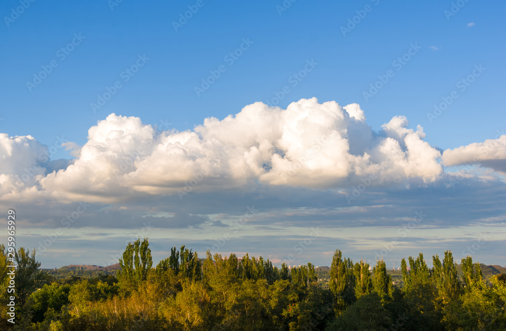 Autumn urban landscape on a Sunny day - yellow autumn trees and bright sky with clouds Autumn urban landscape on a Sunny day - yellow autumn trees and bright sky with clouds