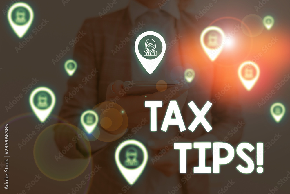 Handwriting text writing Tax Tips. Conceptual photo compulsory contribution to state revenue levied by government Woman wear formal work suit presenting presentation using smart device Handwriting text writing Tax Tips. Conceptual photo compulsory contribution to state revenue levied by government Woman wear formal work suit presenting presentation using smart device