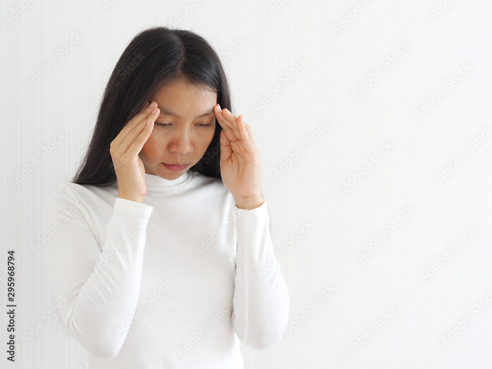 vertigo illness and sick building syndrome or SBS, brain atrophy in asian woman, She use hand touching head and felling headache dizzy sense use for health care concept. vertigo illness and sick building syndrome or SBS, brain atrophy in asian woman, She use hand touching head and felling headache dizzy sense use for health care concept.