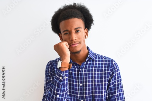 Young african american man wearing casual shirt standing over isolated white background thinking looking tired and bored with depression problems with crossed arms.