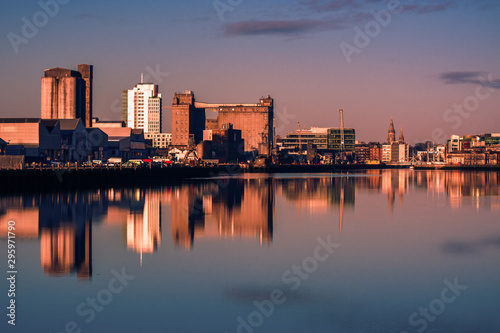 Cork Ireland city center harbor panorama view morning sunrise cold weather calm river water reflection buildings colors 