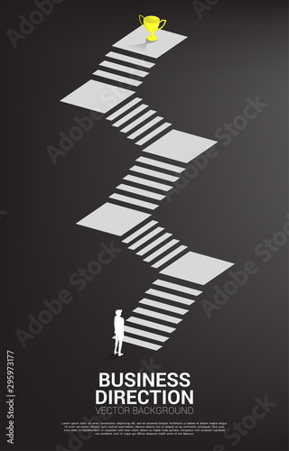 silhouette of businessman ready to step to golden trophy at top of stair. Concept of vision mission and goal of business
