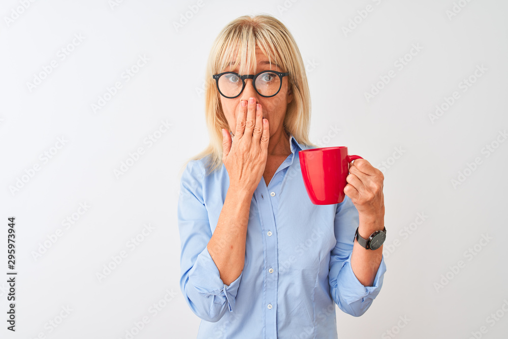 Middle age businesswoman wearing glasses drinking coffee over isolated white background cover mouth with hand shocked with shame for mistake, expression of fear, scared in silence, secret concept Middle age businesswoman wearing glasses drinking coffee over isolated white background cover mouth with hand shocked with shame for mistake, expression of fear, scared in silence, secret concept