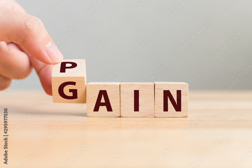Pain or Gain concept, Hand flip wood cube change the word - obrazy, fototapety, plakaty 