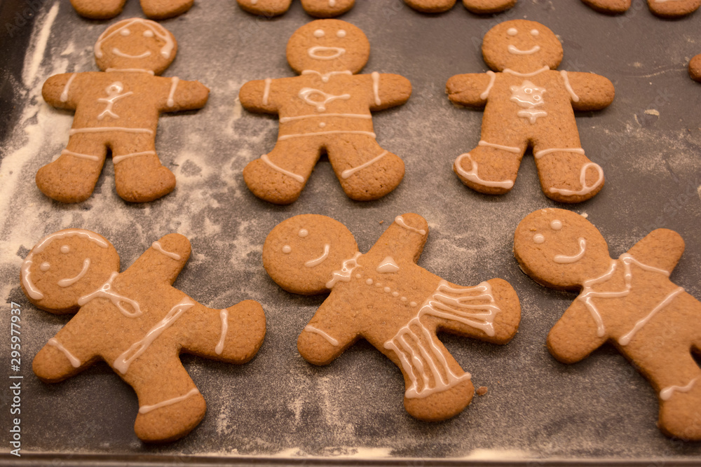 Gingerbread man cookies freshly made at home, just decorated with white icing in a funny and happy style. Great for making with the kids as a family near the Christmas and winter holidays. Gingerbread man cookies freshly made at home, just decorated with white icing in a funny and happy style. Great for making with the kids as a family near the Christmas and winter holidays.