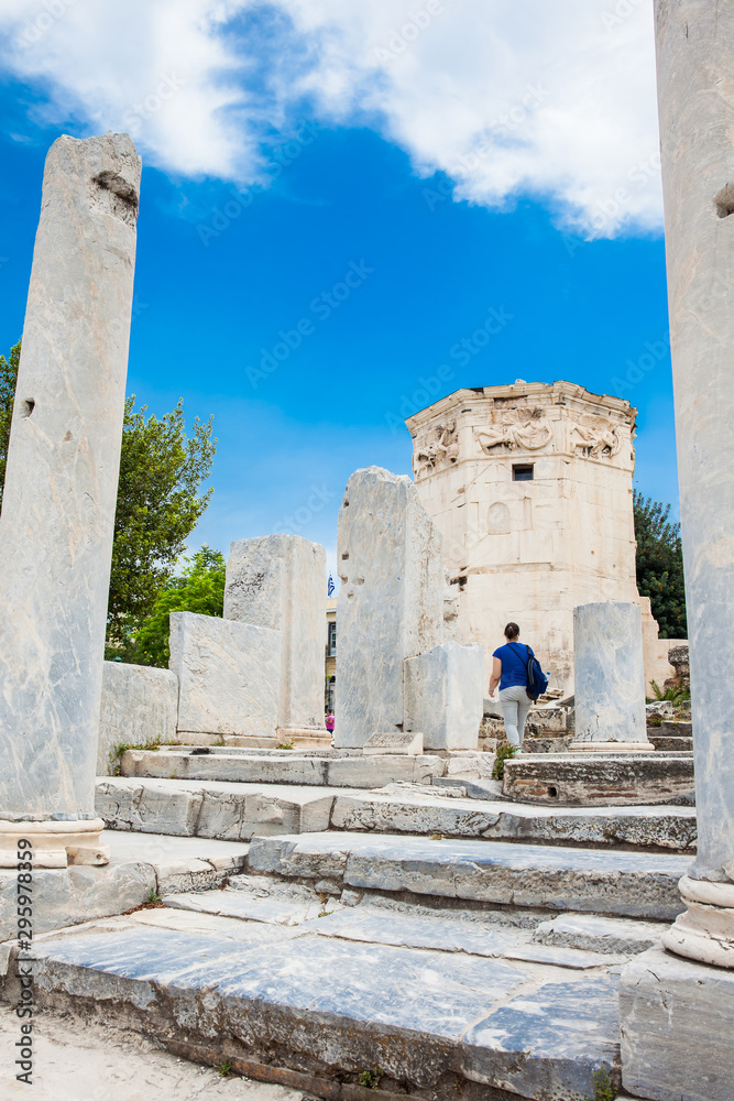 Tourist visiting the Tower of the Winds or the Horologion of Andronikos