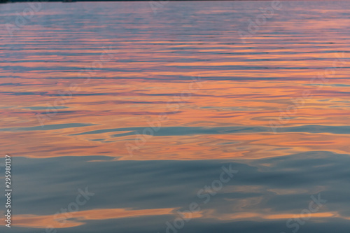 Pink Sunset Light Reflects on Ripples