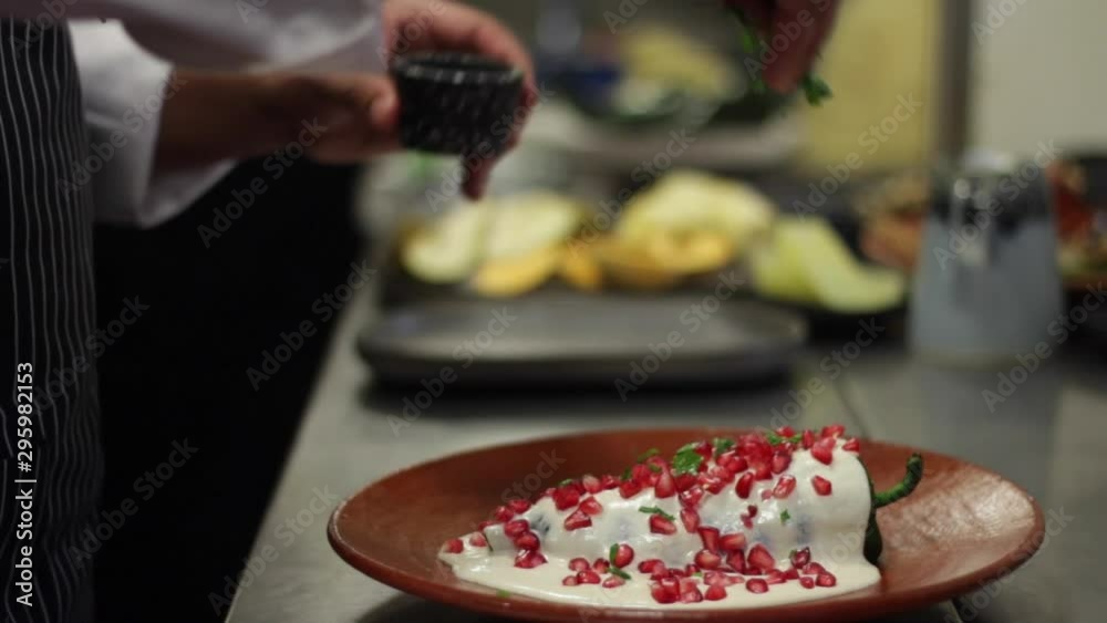 chef preparing chile en nogada, mexican traditional dish