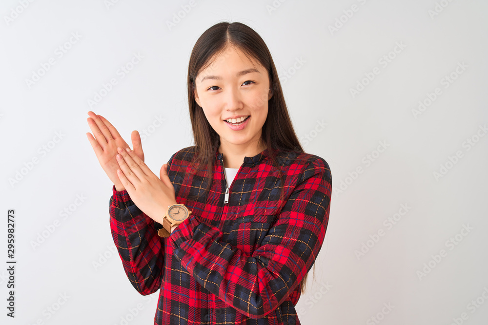 Young chinese woman wearing casual jacket standing over isolated white background clapping and applauding happy and joyful, smiling proud hands together Young chinese woman wearing casual jacket standing over isolated white background clapping and applauding happy and joyful, smiling proud hands together