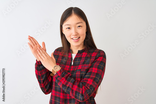 Young chinese woman wearing casual jacket standing over isolated white background clapping and applauding happy and joyful, smiling proud hands together