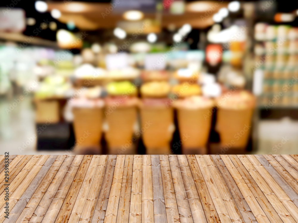 Wooden table with shopping mall blurred background