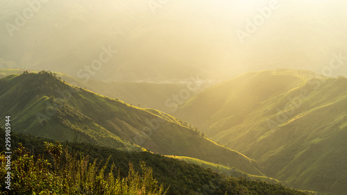 The view of the mountains with warm light in the morning.