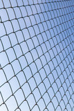 Metal mesh against the blue sky.