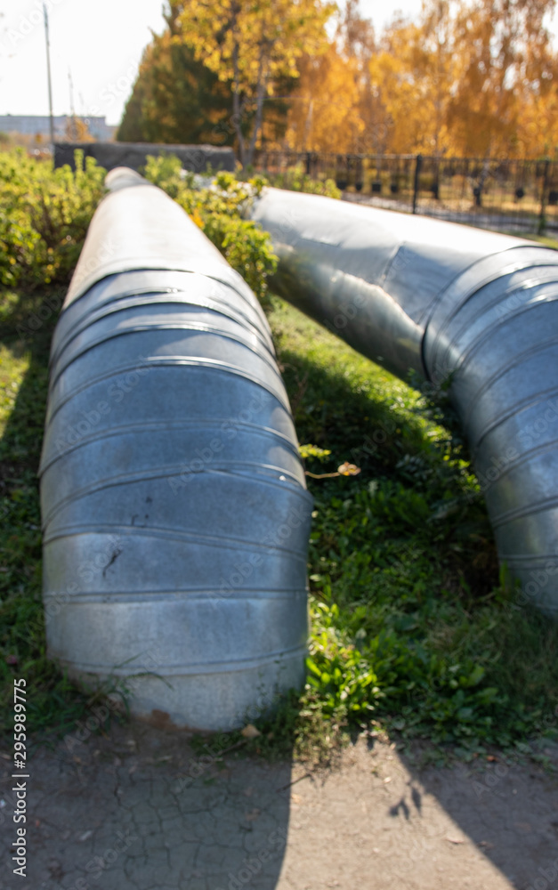 Insulated heat pipes on the street. Insulated heat pipes on the street.