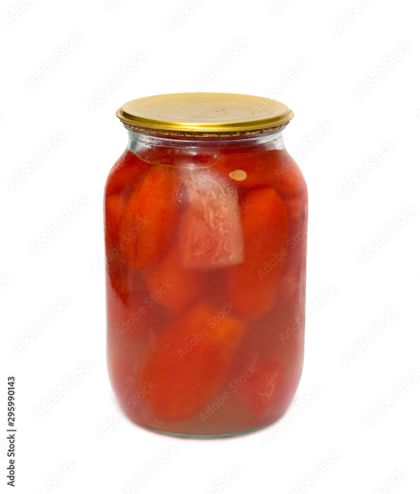 Glass jar with tomatoes closed on a white background. Glass jar with tomatoes closed on a white background.