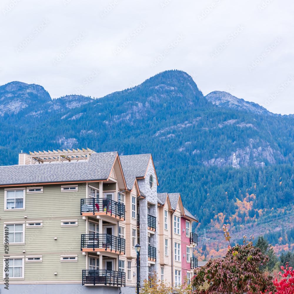The top of an apartment building with nice windows. The top of an apartment building with nice windows.