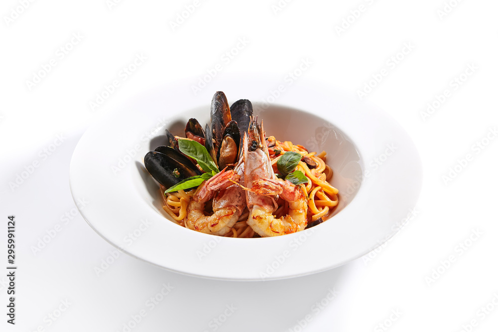 Delicious spaghetti with seafood and tomatoes close up Delicious spaghetti with seafood and tomatoes close up