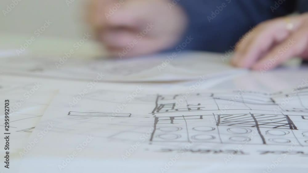 Designer architect drawing sketches with pen. Designer architect drawing sketches with pen.