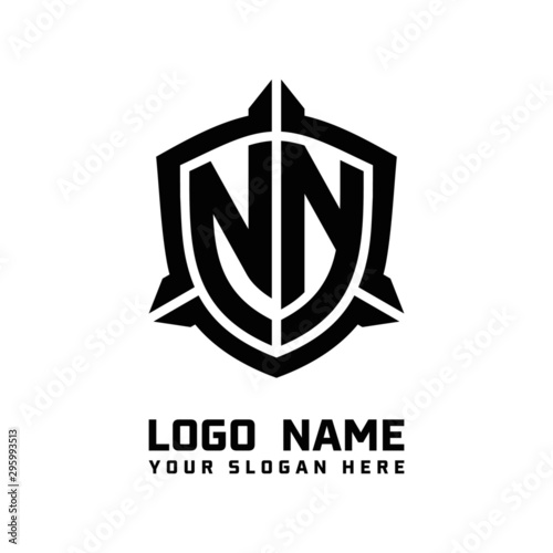 initial NN letter with shield style logo template vector. shield shape black monogram logo