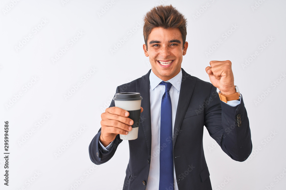 Young handsome businessman wearing suit holding coffee over isolated white background screaming proud and celebrating victory and success very excited, cheering emotion Young handsome businessman wearing suit holding coffee over isolated white background screaming proud and celebrating victory and success very excited, cheering emotion