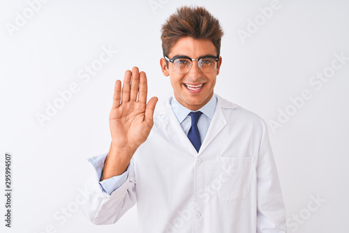 Young handsome sciencist man wearing glasses and coat over isolated white background Waiving saying hello happy and smiling, friendly welcome gesture