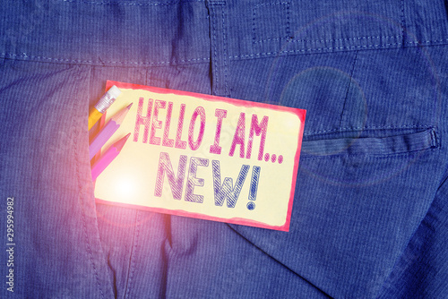 Conceptual hand writing showing Hello I Am New. Concept meaning used as greeting or to begin telephone conversation Writing equipment and yellow notepaper in pocket of trousers