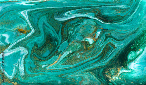 Green and gold glitter ripple pattern. Beautiful liquid texture.