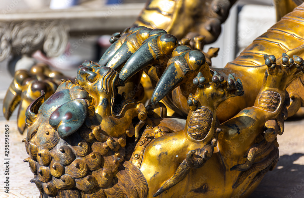 Fototapeta premium A golden lion statue in the Forbidden City, the main buildings of the former royal palace of Ming dynasty and Qing dynasty in Beijing China.