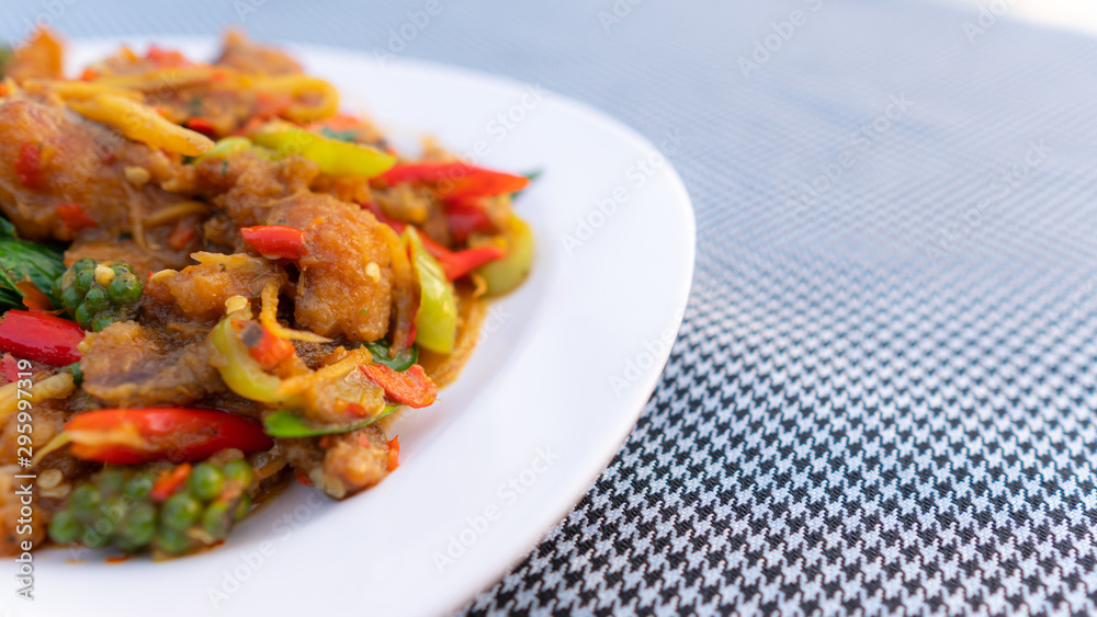 Fototapeta premium Stir-Fried Spicy Fish on white dish,select focus.