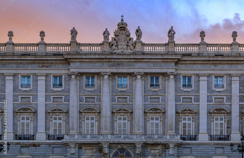 Sunset view of the ornate baroque architecture of the Royal Palace viewed from Plaza de Oriente in Madrid, Spain