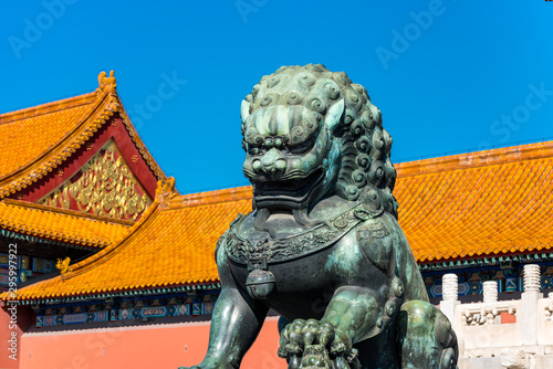 A bronze lion statue in front of the Taihe Palace, Hall of Supreme Harmony of the Forbidden City, the main buildings of the former royal palace of Ming dynasty and Qing dynasty in Beijing China. photo