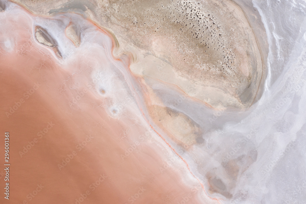 Abstract top down view of a large pink salt lake located next to highway 40 in the wheatbelt region of Western Australia