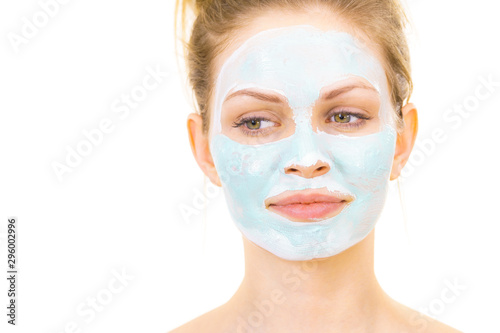 Girl with green mud mask on face