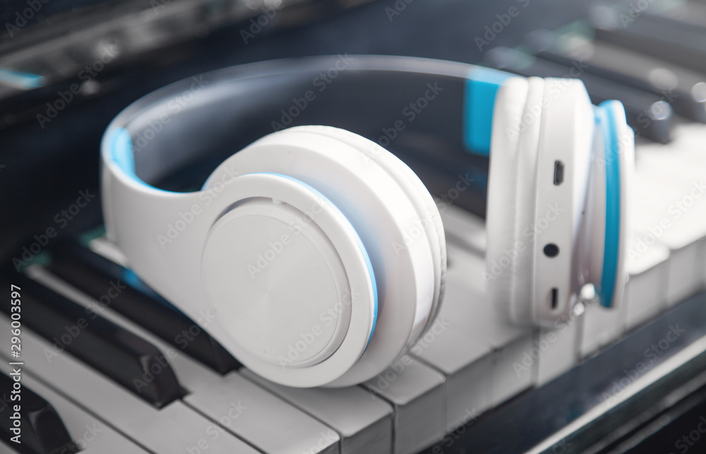 Headphones on the piano keyboard. Music