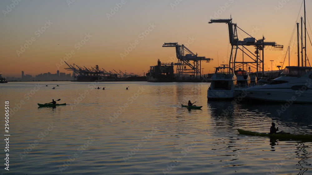 Sunset at Port with Kayakers in water