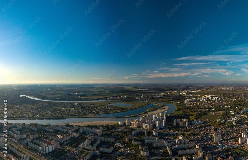 panorama view over the bend of the Kuban River at the western outskirts - the area of the agricultural university and the Novy Gorod microdistrict at the end of an autumn day before sunset
