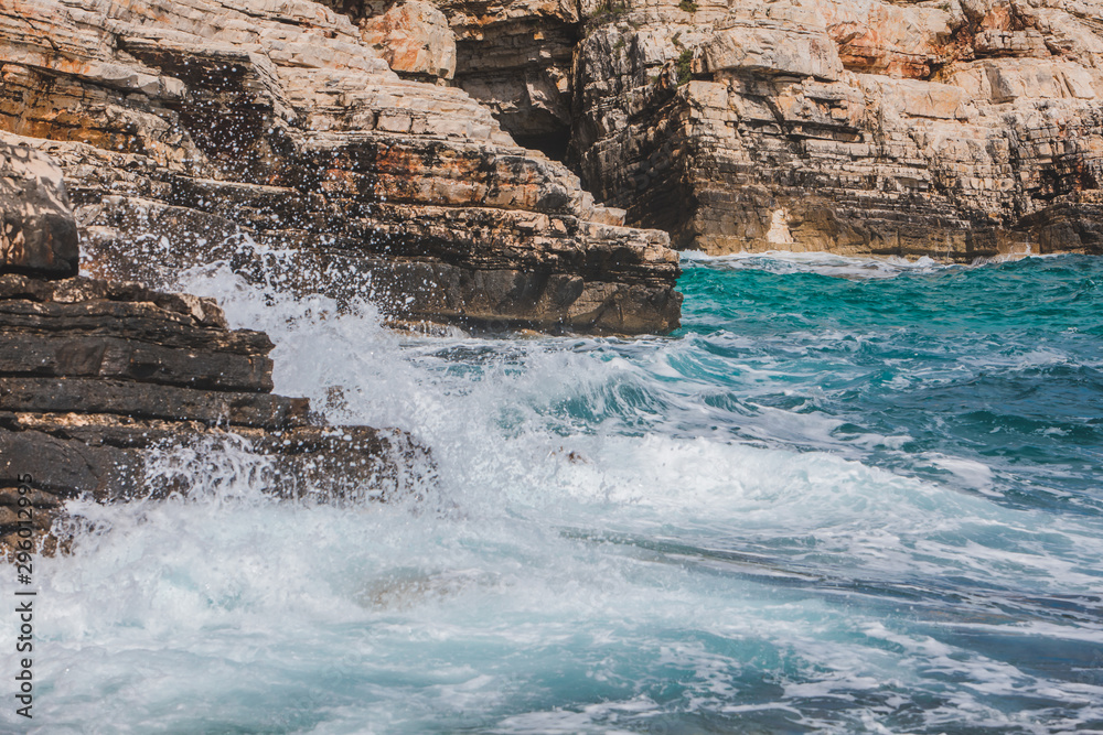 view of rocky seaside waves with white foam view of rocky seaside waves with white foam
