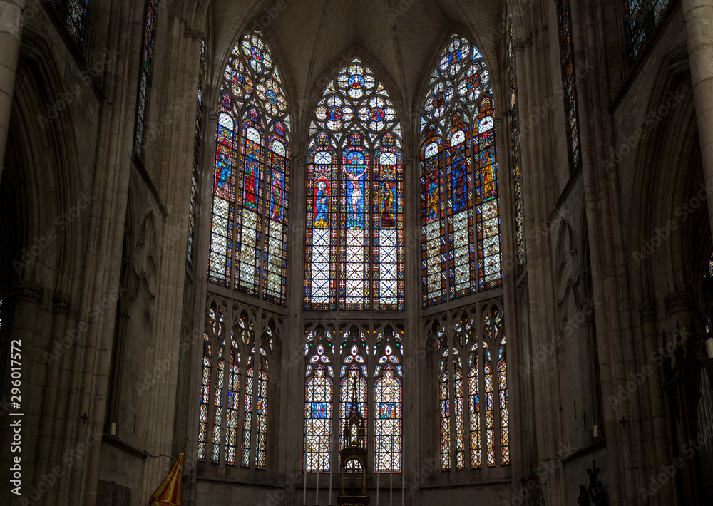 Colorful stained glass windows and altar in  Basilique Saint-Urbain, 13th century gothic church in Troyes, France