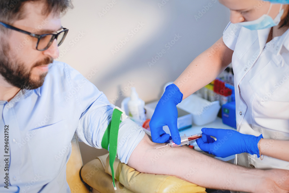 Nurse takes a blood test. Nurse takes a blood test.