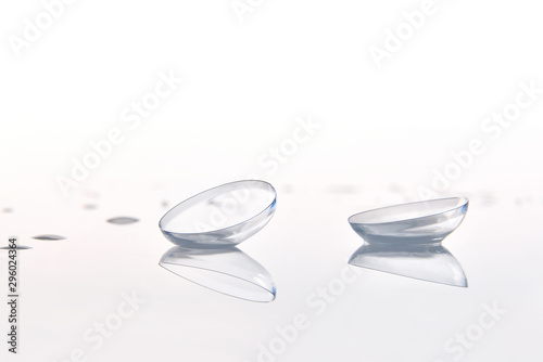 Contact lenses macro on glass with white background front