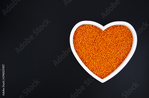 Delicious beans in a heart shaped plate