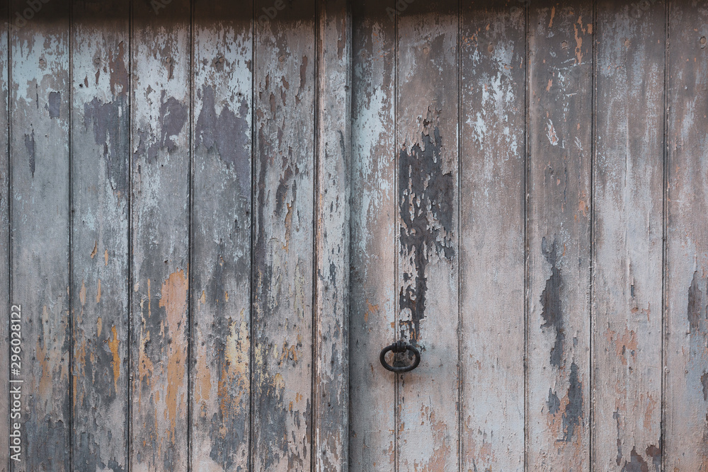 Old barn door with flaking paint Old barn door with flaking paint
