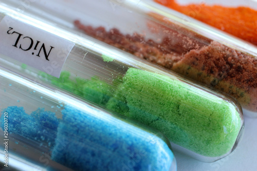 Green crystals of nickel chloride in test tube. The substance is used in electroplating. photo